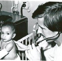 Dr. Victor Lipp, Staff Pediatrician,examines young patient.